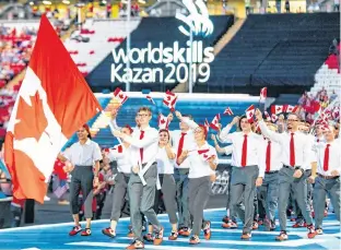 Justin Buchanan from Knutsford, P.E.I. leads the Cana­dian del­e­ga­tion into the open­ing cer­e­monies for the World Skills Com­pe­ti­tion in Kazan, Rus­sia. Buchanan com­peted in 3-D Dig­i­tal Game Art.