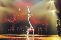 Cirque du Soleil ac­ro­bats are seen per­form­ing in 2019. The com­pany has laid off al­most 5,000 per­form­ers and crew, and staffers in the Mon­treal head of­fice amid the COVID-19 pan­demic.