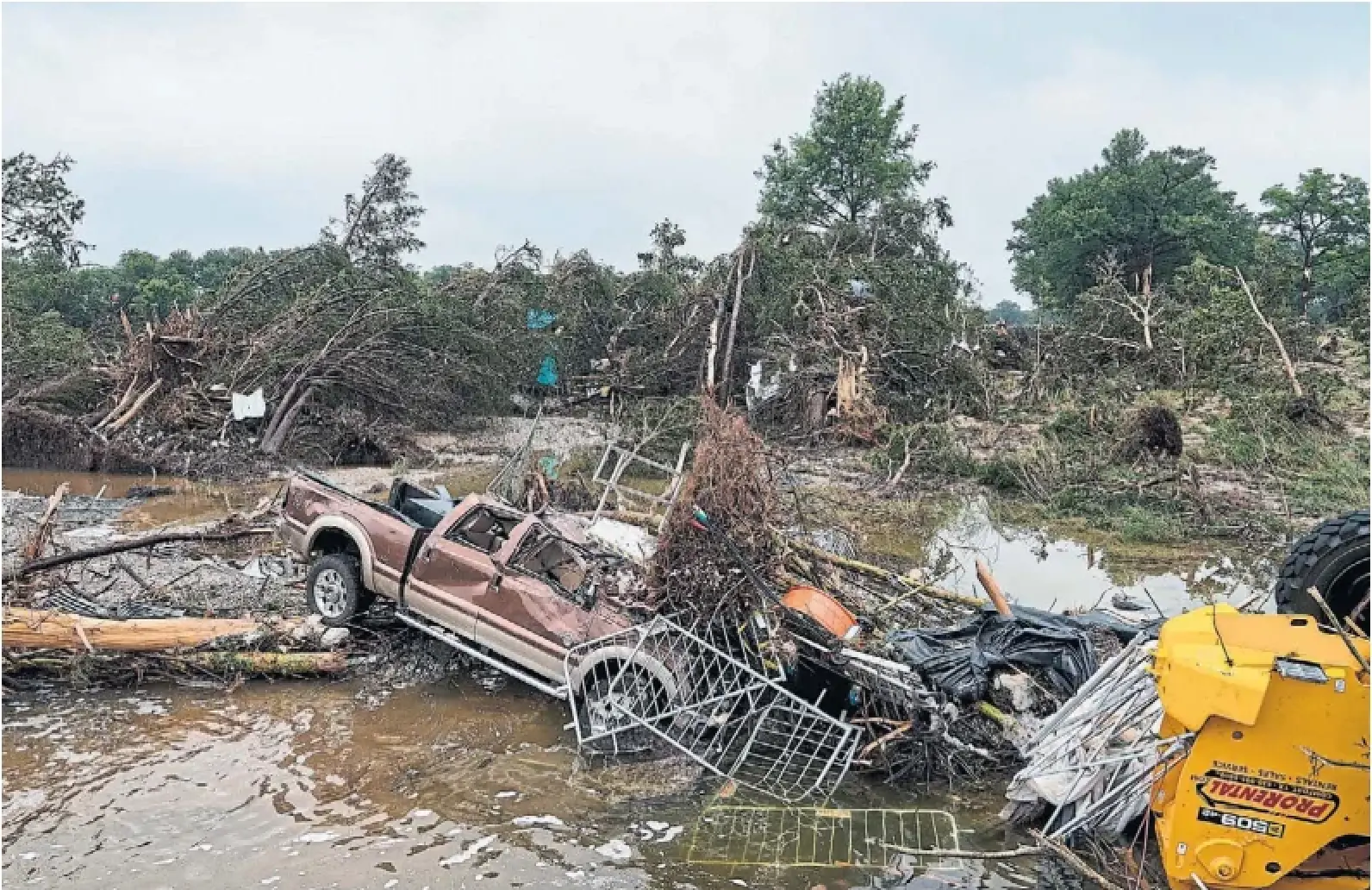 Floodwaters left debris, including vehicles and equipment, scattered in Louise Hays Park in Kerrville, Texas, on Saturday.