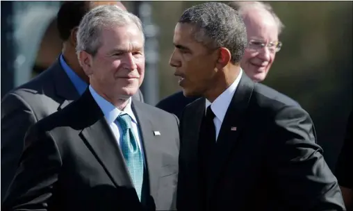 Then-Pres­i­dent Barack Obama shakes hands with for­mer Pres­i­dent Ge­orge W. Bush af­ter Obama spoke to a large crowd near the Ed­mund Pet­tus Bridge on March 7, 2015, in Selma, Ala.