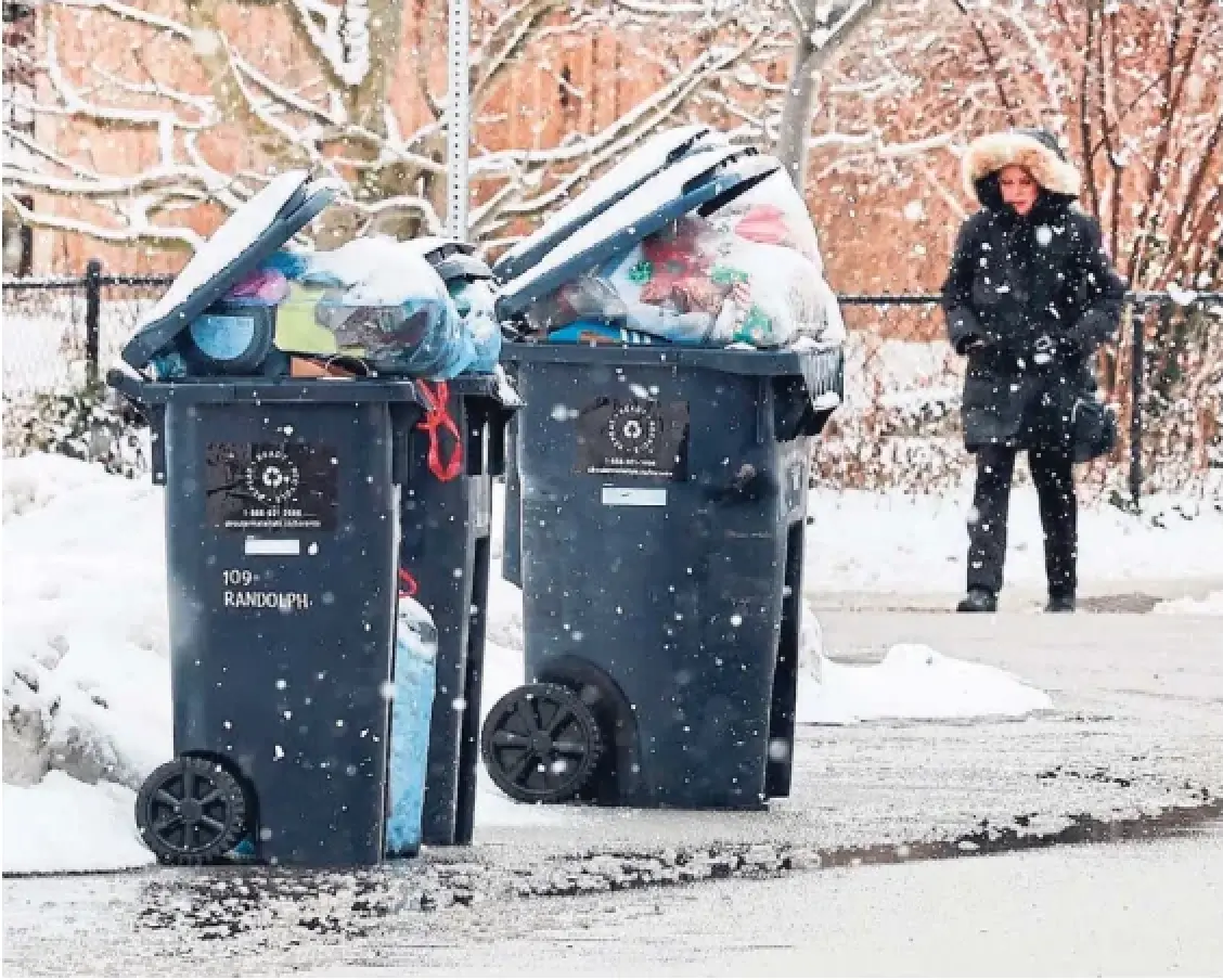 The launch of the province's new blue box program has been bumpy, with missed pickups a nd confusing information causing headaches for residents. In this photo from Sunday, bins overflow along Randolph Road.