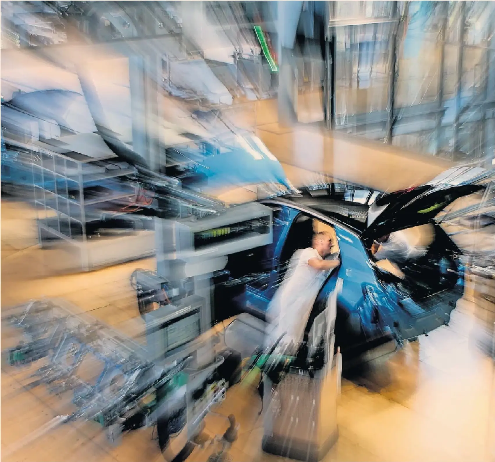 A worker on the electric car production line at VW’s ‘transparent factory’ in Dresden. The glass-walled site was originally conceived as a showcase for both German reunification and VW’s engineering prowess