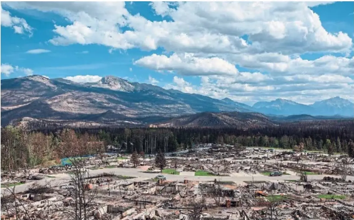 A Jasper, Alta., neighbourhood is devastated after a wildfire in August 2024. Visitor numbers to the Alberta city are about as good as they can be, considering about onefifth of the town's overnight accommodations burned in the fire, said Tourism Jasper CEO Tyler Riopel.