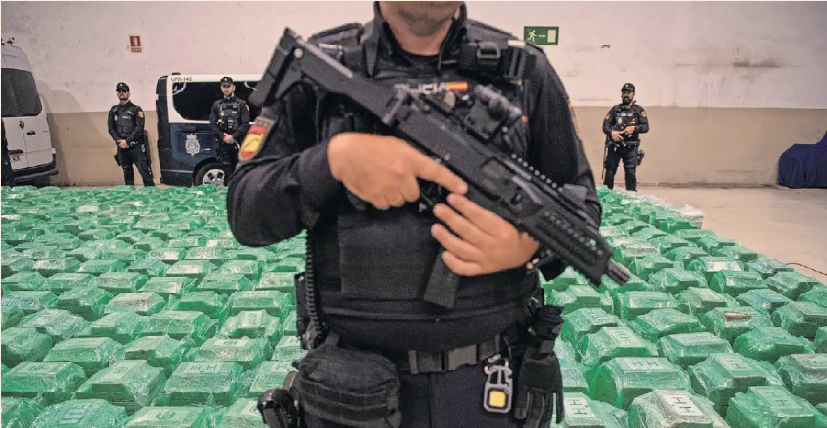 Busted: Spanish police with cocaine found in a shipping container from Ecuador