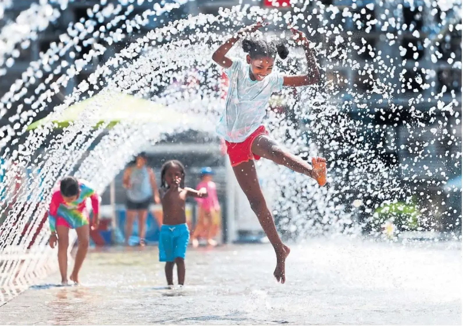 The fountain in Mississauga's Celebration Square offers relief on Monday as temperatures hovered in the mid30s.