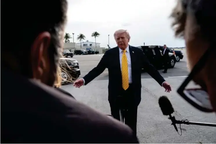 The US president speaks to reporters at Palm Beach nternationa l airport in Florida