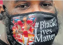 No more: A pro­tester wears a face mask at a protest in Wash­ing­ton against racism and po­lice bru­tal­ity. Protests are be­ing held across the world fol­low­ing the death of Ge­orge Floyd on May 25.