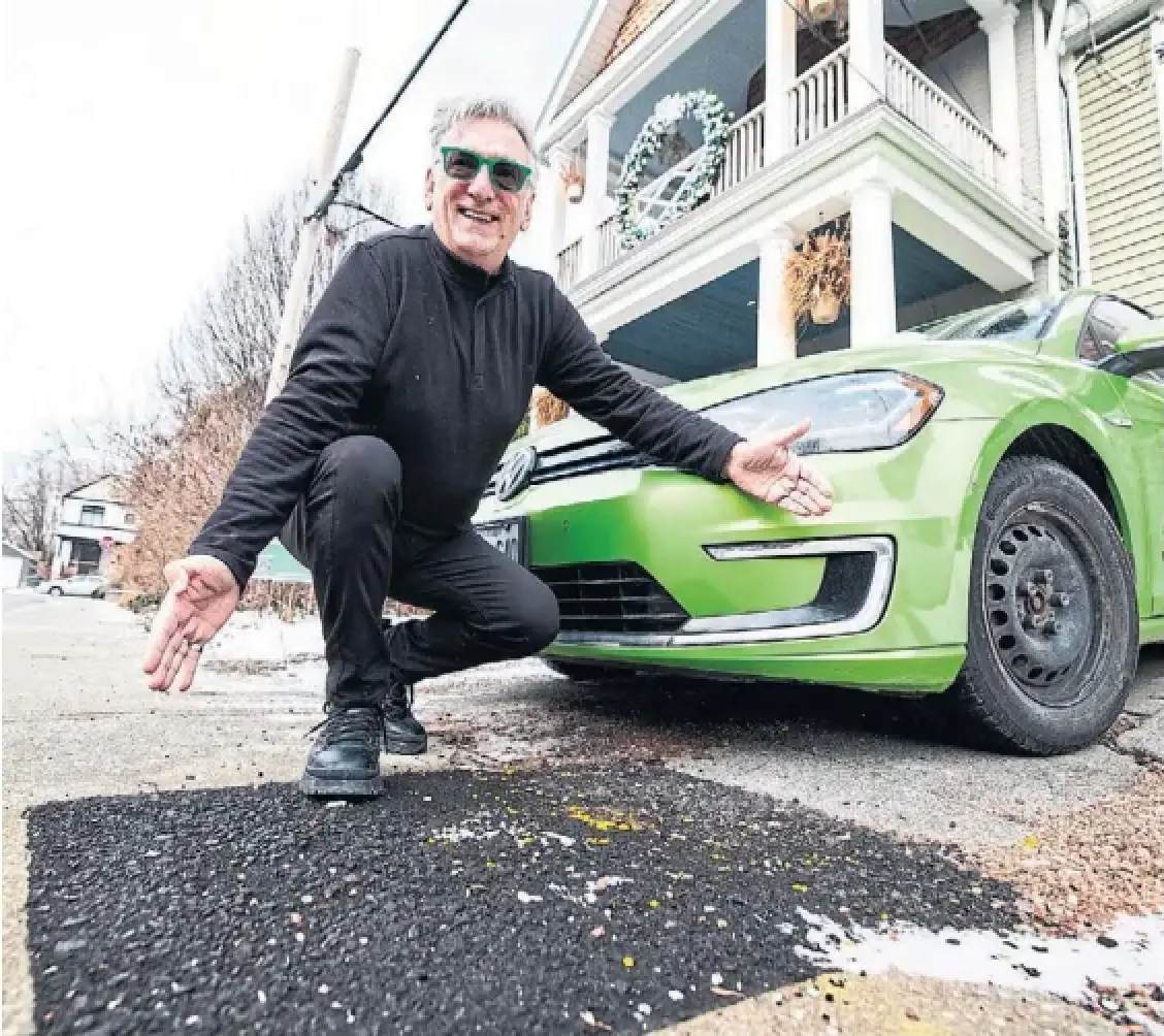 Paul Dowsett shows off the spot where Enbridge had to dig up the sidewalk to physically disconnect him from their grid. Dowsett was told contradictory things by Enbridge about how to end his gas service.