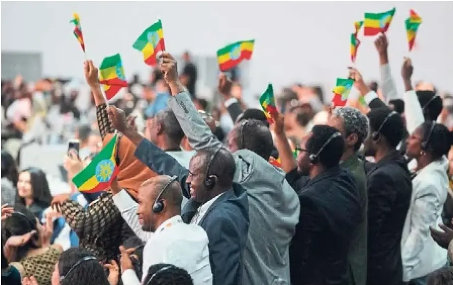 Delegates from Ethiopia, hosts of COP32, cheer during a plenary session at the COP30 UN Climate Summit in Belem, Brazil. The climate talks ended Saturday with a compromise that some criticized as weak and others called progress.