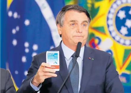 Di­vul­ga­dor. Bol­so­na­ro de­fen­den­do a clo­ro­qui­na na TV: ‘Uma vi­são mui­to equi­vo­ca­da’, se­gun­do pre­si­den­te da AMB