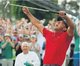 Spec­tac­u­lar: Tiger Woods of the US cel­e­brates on the 18th hole af­ter win­ning the 2019 Masters at the Au­gusta Na­tional Golf Club in Ge­or­gia on Sun­day. End­ing an 11-year ma­jor drought, the Amer­i­can seized his first ma­jor ti­tle since the 2008 US Open.